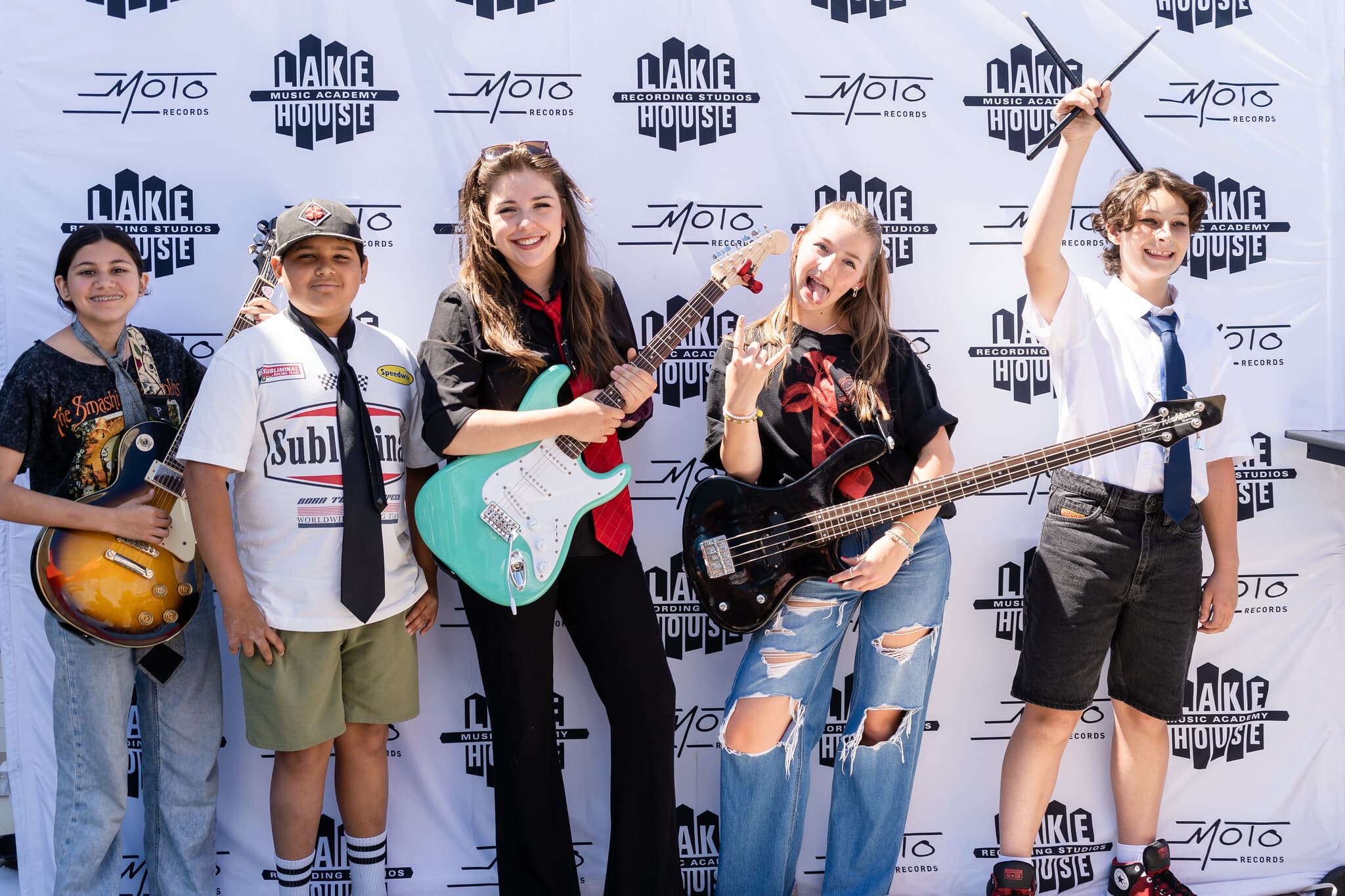 Young Lakehouse musicians posing with their instruments